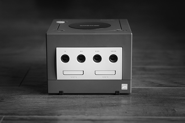 A black and white photo of box-shaped device on a wooden floor - used to illustrate a point about useless boxes taking up space