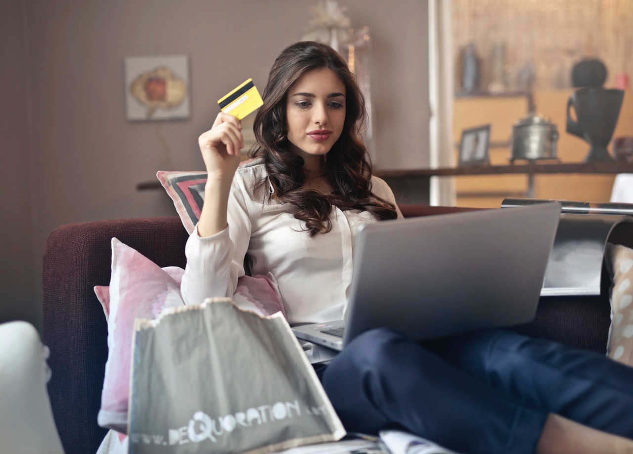 converted female customer on couch buying online