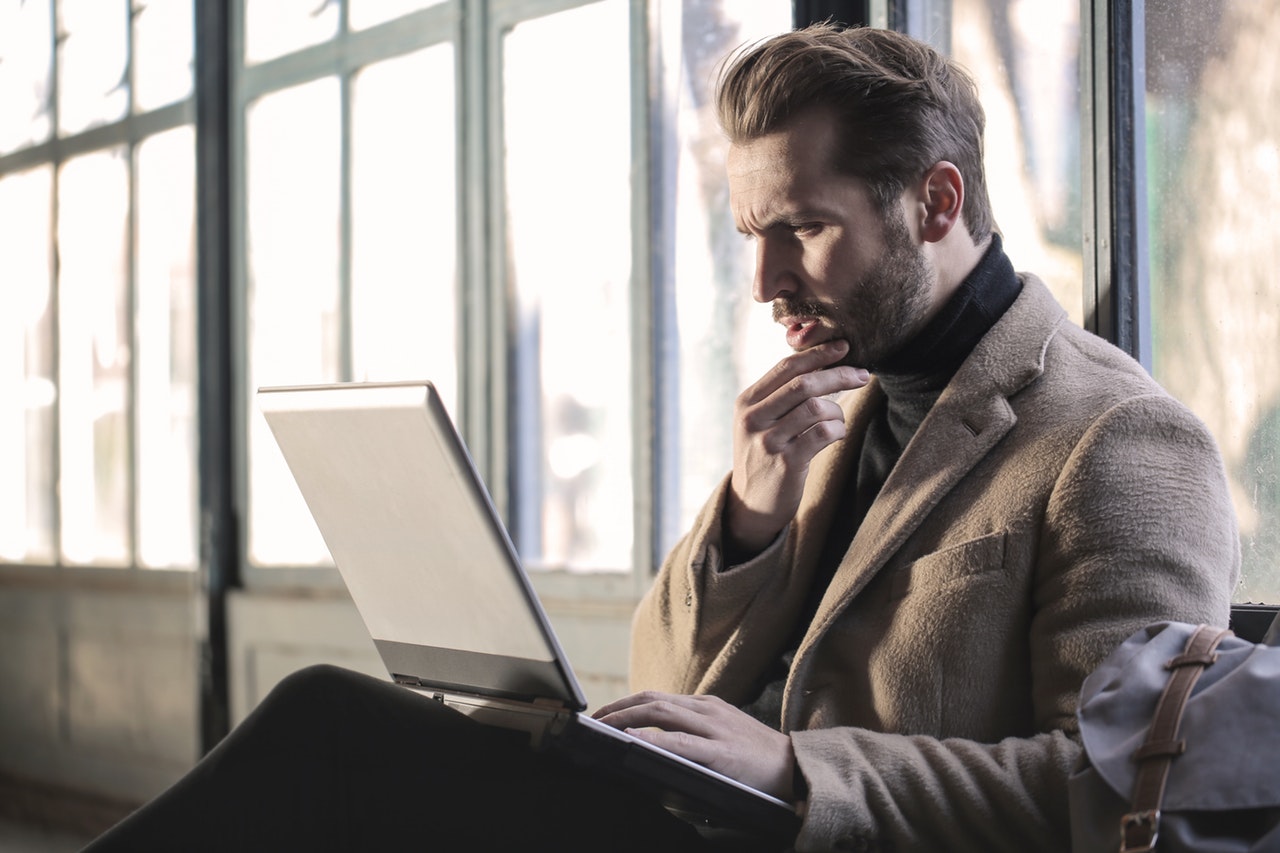 confused man looking at a bad web design