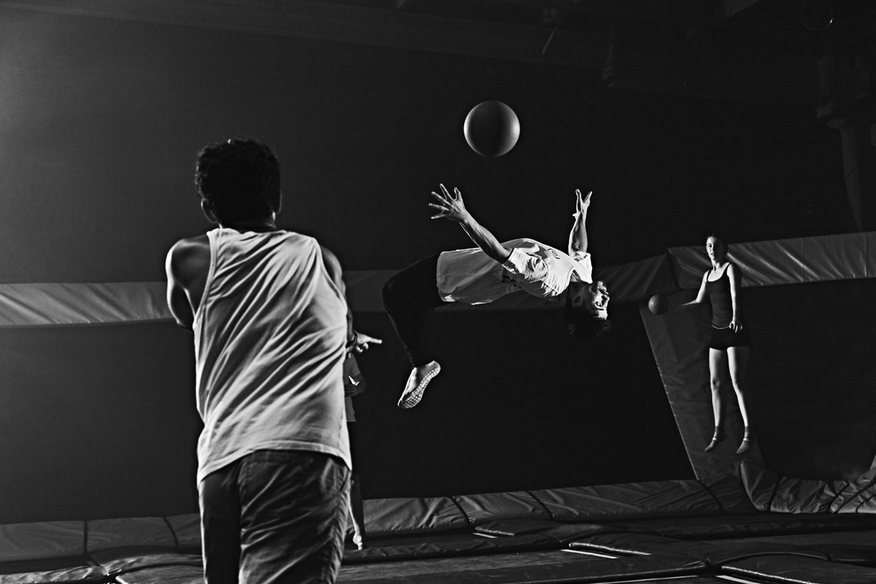 boy dodging a ball in a dodgeball game