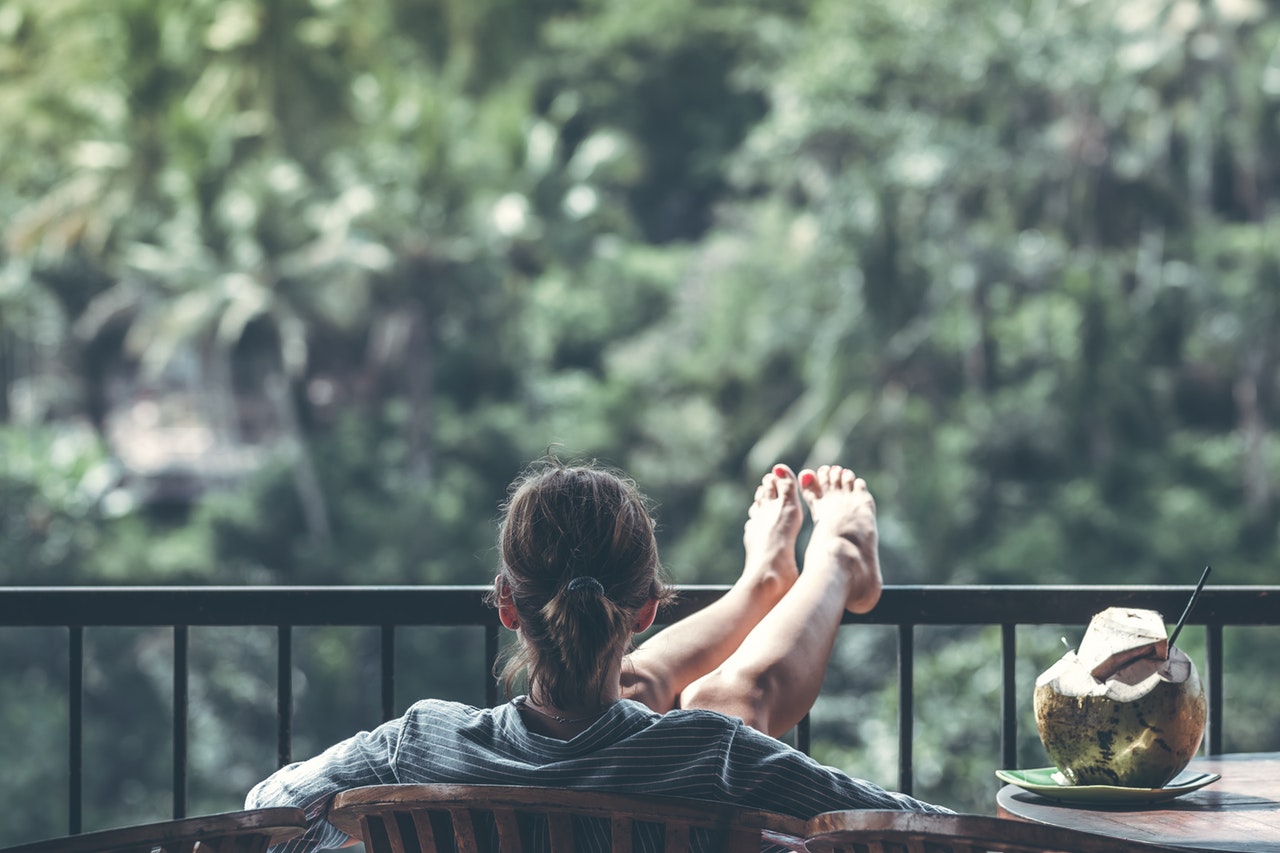 woman relaxing with a beverage after being productive with her new found wordpress tools